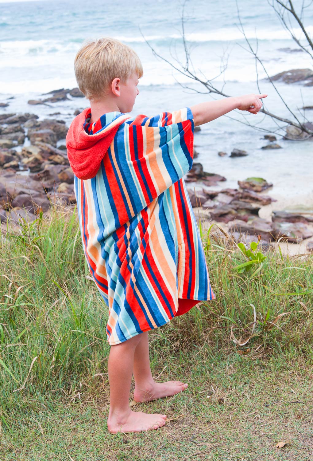 This soft and absorbent hooded towel is perfect for kids, toddlers, and babies, doubling as a surf poncho or beach robe to keep them warm and dry after swimming